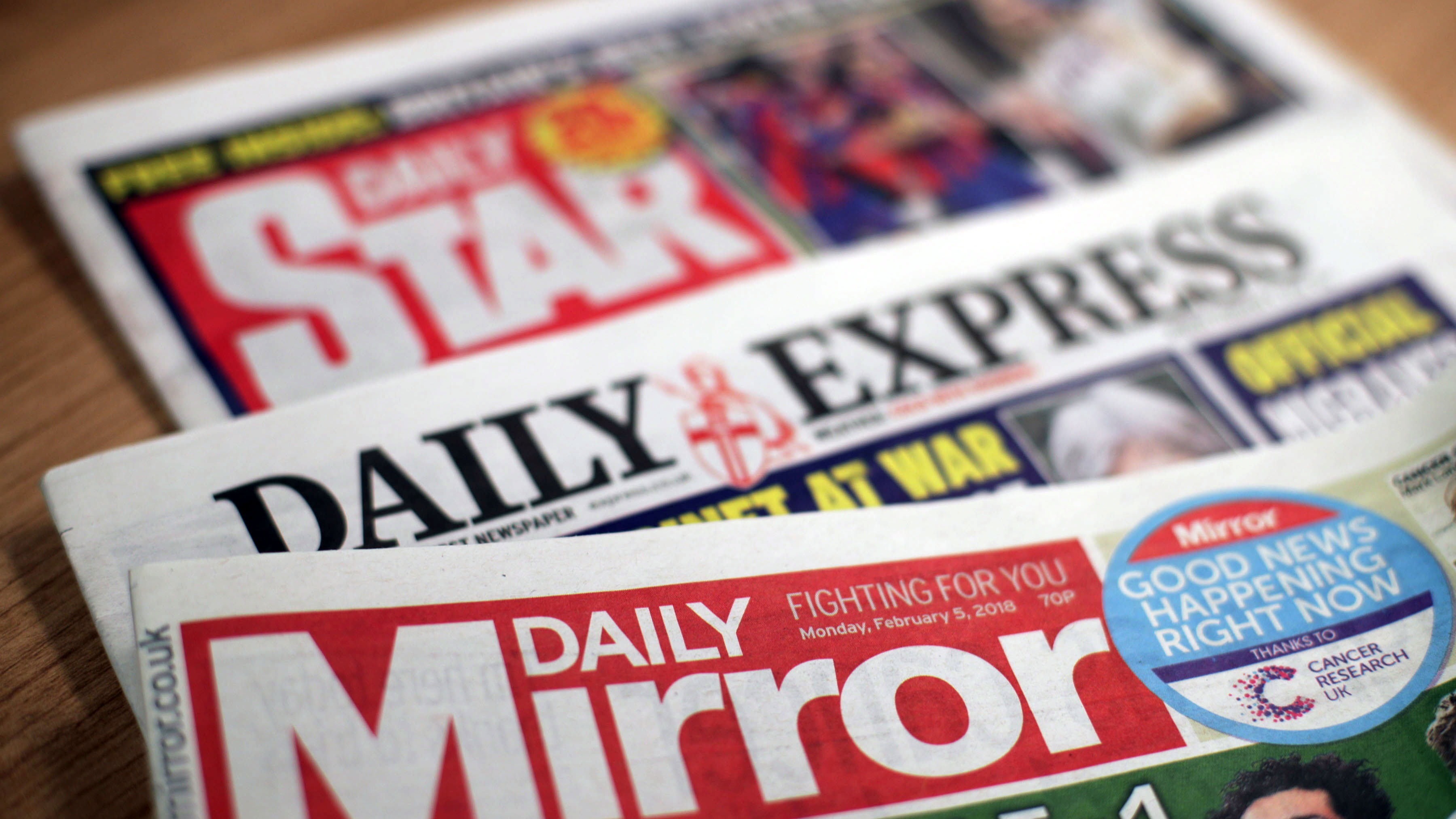 Reach halves dividend as profits slump